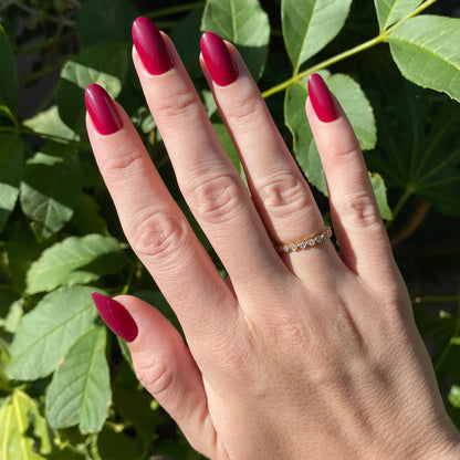 SC - Press-On | Medium | Oval hand with medium oval false nails in rich deep bordeaux polish for an elegant at home mani