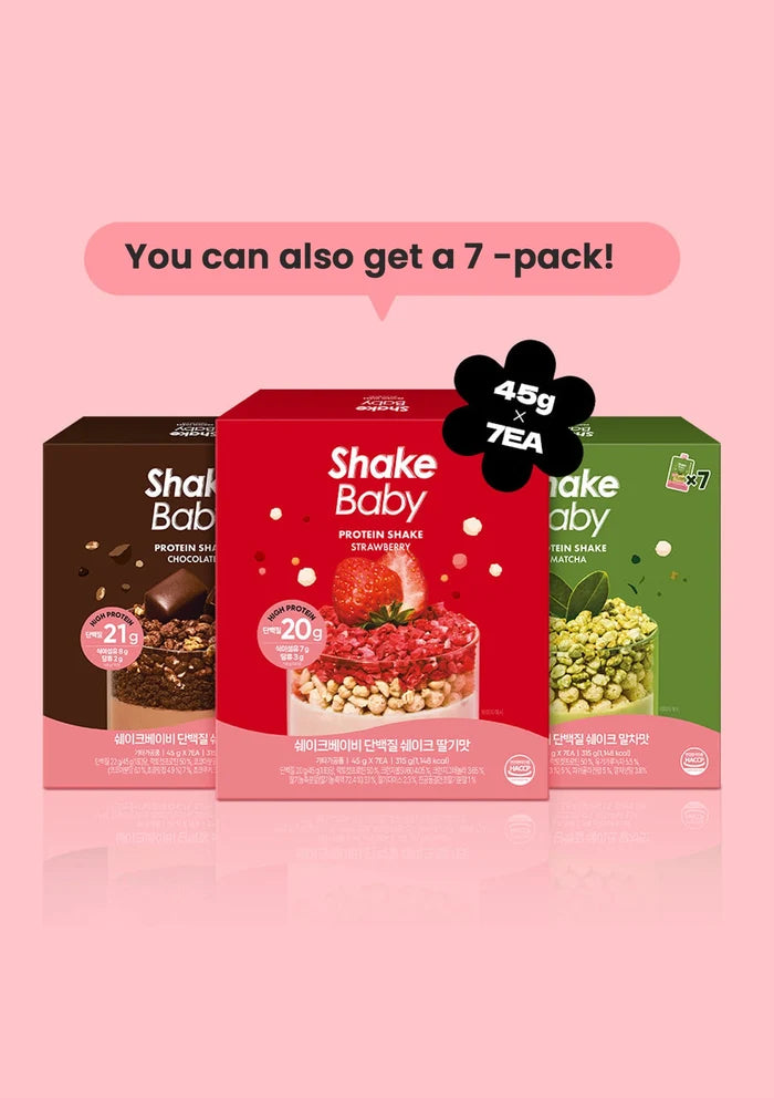 Three Shake Baby protein shake boxes displayed together on a pink background, with a speech bubble above reading 'You can also get a 7-pack!' and a black flower-shaped badge showing '45g x 7 TEA'. The center box is red strawberry, flanked by dark brown chocolate and green pea flavors.