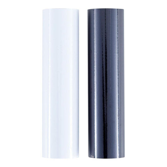 Spellbinders - Glimmer Foil - Opaque Black & White. This Glimmer Hot Foil pack comes in a new 2 pack box format. Each roll is 15 ft. by 5 in. Add stunning and eye-catching foil designs to any project from paper crafts to mixed media and more! Available at Embellish Away located in Bowmanville Ontario Canada.