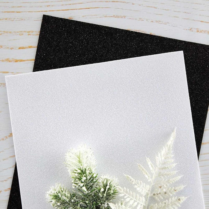 Spellbinders - Glitter Foam Sheets 8.5"X11" - 10/Pkg - Black & White. Pop-Up Die Cutting Glitter Foam Sheets Black & White is a pack of 10 EVA foam sheets. It includes five sheets each of Glitter Black and Glitter White. Available at Embellish Away located in Bowmanville Ontario Canada.
