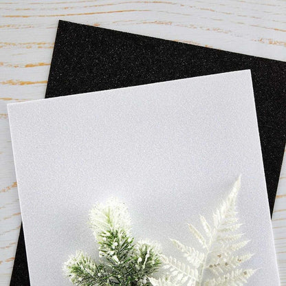 Spellbinders - Glitter Foam Sheets 8.5"X11" - 10/Pkg - Black & White. Pop-Up Die Cutting Glitter Foam Sheets Black & White is a pack of 10 EVA foam sheets. It includes five sheets each of Glitter Black and Glitter White. Available at Embellish Away located in Bowmanville Ontario Canada.