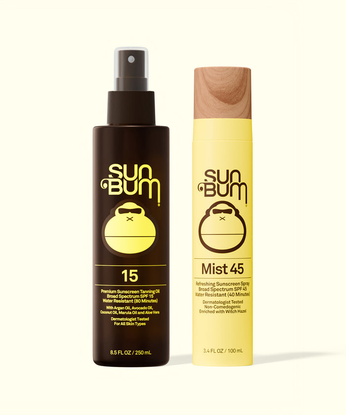 Sun Bum SPF 15 Tanning Oil + Mist 45 with spray bottles featuring brown and yellow packaging