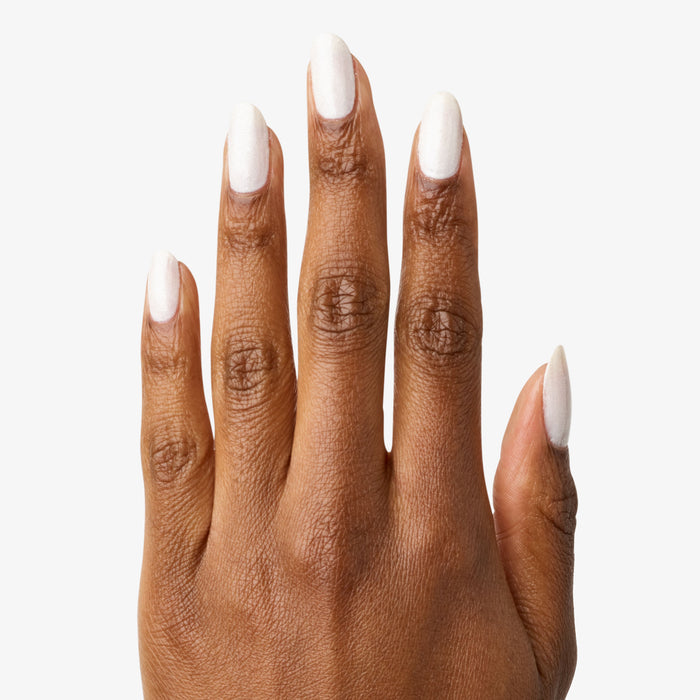 Hand with nails polished in STELLAR sparkly white for a smooth, long-lasting manicure with subtle shimmer finish
