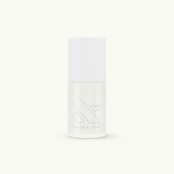 Bottle of STELLAR nail polish by Olive and June with a smooth, sparkly white finish for long-lasting manicures or pedicures