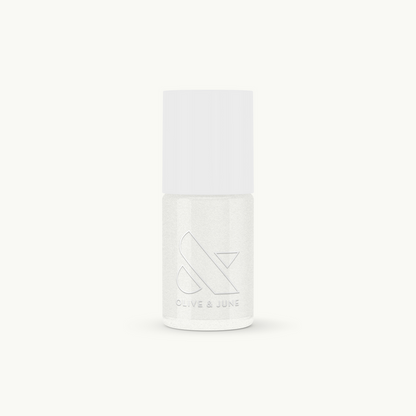 Bottle of STELLAR nail polish by Olive and June with a smooth, sparkly white finish for long-lasting manicures or pedicures