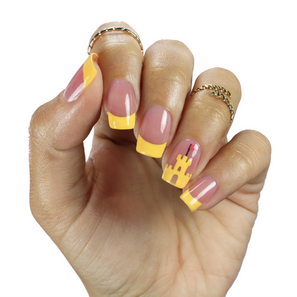 Strong sheer mauve nail polish with yellow French tip nail art on a medium skin tone