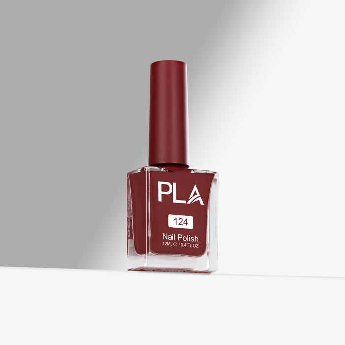 Red nail polish bottle with 'PLA' branding on a gray background