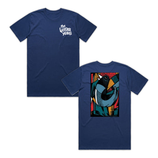 A navy blue The Wonder Years Staple T-shirt with their logo on the front left chest and a vibrant abstract bird design with geometric shapes and bold lines on the back—a standout printed tee.