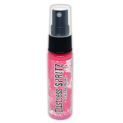 Tim Holtz = Distress Spritz 1oz Bottle - Select from Drop Down. Uncharted Mariner, Picked Raspberry, Spiced Marmalade, Fossilized Amber, Peeled Paint, Twisted Citron, Worn Lipstick, Walnut Stain, Wilted Violet, Barn Door, Weathered Wood, Peacock Feathers Available at Embellish Away located in Bowmanville Ontario Canada Picked Raspberry
