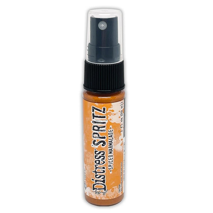 Tim Holtz = Distress Spritz 1oz Bottle - Select from Drop Down. Uncharted Mariner, Picked Raspberry, Spiced Marmalade, Fossilized Amber, Peeled Paint, Twisted Citron, Worn Lipstick, Walnut Stain, Wilted Violet, Barn Door, Weathered Wood, Peacock Feathers Available at Embellish Away located in Bowmanville Ontario Canada Spice Marmalade
