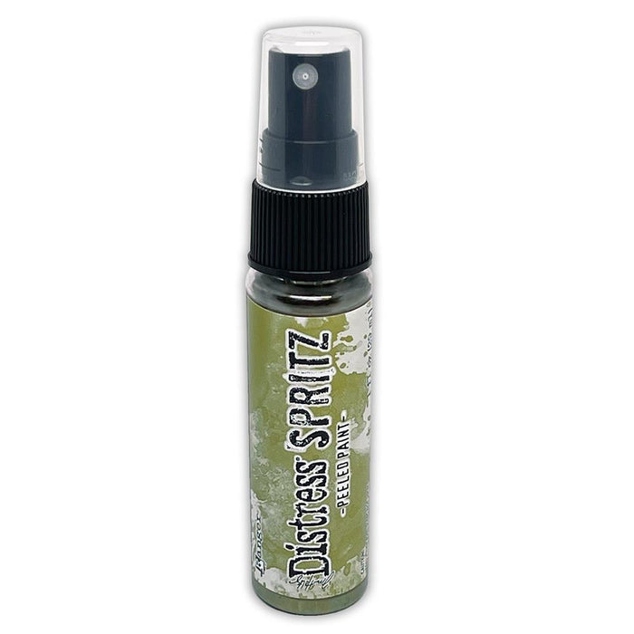 Tim Holtz = Distress Spritz 1oz Bottle - Select from Drop Down. Uncharted Mariner, Picked Raspberry, Spiced Marmalade, Fossilized Amber, Peeled Paint, Twisted Citron, Worn Lipstick, Walnut Stain, Wilted Violet, Barn Door, Weathered Wood, Peacock Feathers Available at Embellish Away located in Bowmanville Ontario Canada Peeled Paint