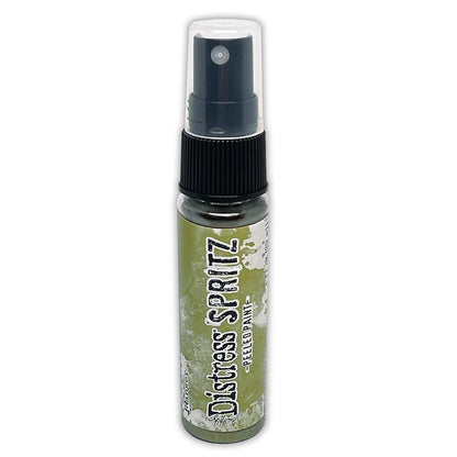 Tim Holtz = Distress Spritz 1oz Bottle - Select from Drop Down. Uncharted Mariner, Picked Raspberry, Spiced Marmalade, Fossilized Amber, Peeled Paint, Twisted Citron, Worn Lipstick, Walnut Stain, Wilted Violet, Barn Door, Weathered Wood, Peacock Feathers Available at Embellish Away located in Bowmanville Ontario Canada Peeled Paint