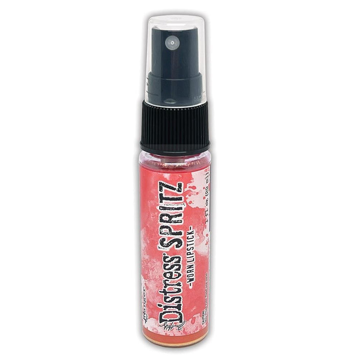 Tim Holtz = Distress Spritz 1oz Bottle - Select from Drop Down. Uncharted Mariner, Picked Raspberry, Spiced Marmalade, Fossilized Amber, Peeled Paint, Twisted Citron, Worn Lipstick, Walnut Stain, Wilted Violet, Barn Door, Weathered Wood, Peacock Feathers Available at Embellish Away located in Bowmanville Ontario Canada Worn Lipstick