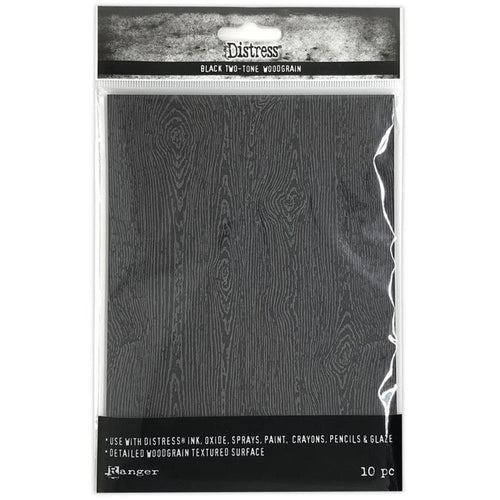 Tim Holtz - Distress Woodgrain Cardstock - 5"X7" - 10/Pkg - Black. Distress Halloween Woodgrain cardstock is a heavyweight 111lb surface featuring all the characters of real wood including knots and feels real to the touch, without the splinters! Available at Embellish Away located in Bowmanville Ontario Canada.