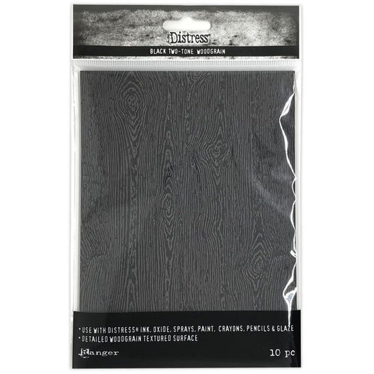 Tim Holtz - Distress Woodgrain Cardstock - 5"X7" - 10/Pkg - Black. Distress Halloween Woodgrain cardstock is a heavyweight 111lb surface featuring all the characters of real wood including knots and feels real to the touch, without the splinters! Available at Embellish Away located in Bowmanville Ontario Canada.