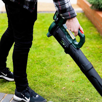 Webb Eco 20v 160mph Cordless Axial Blower held by man in garden