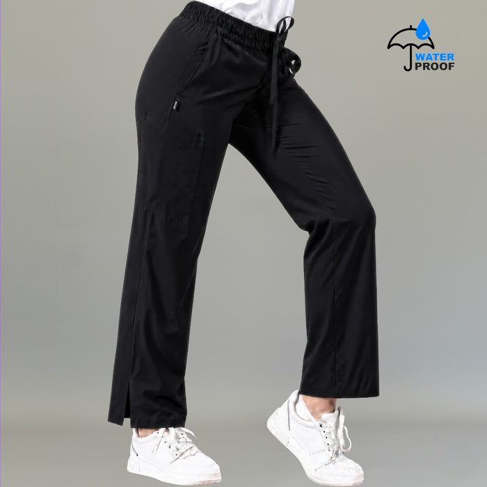 Women's black 502 scrub pants walking pose with elastic drawstring waist — lightweight fluid-resistant medical scrub pants S-FOR-ME