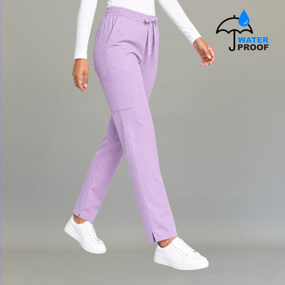 Women's lilac 502 scrub pants walking pose with elastic drawstring waist — lightweight fluid-resistant medical scrub pants S-FOR-ME