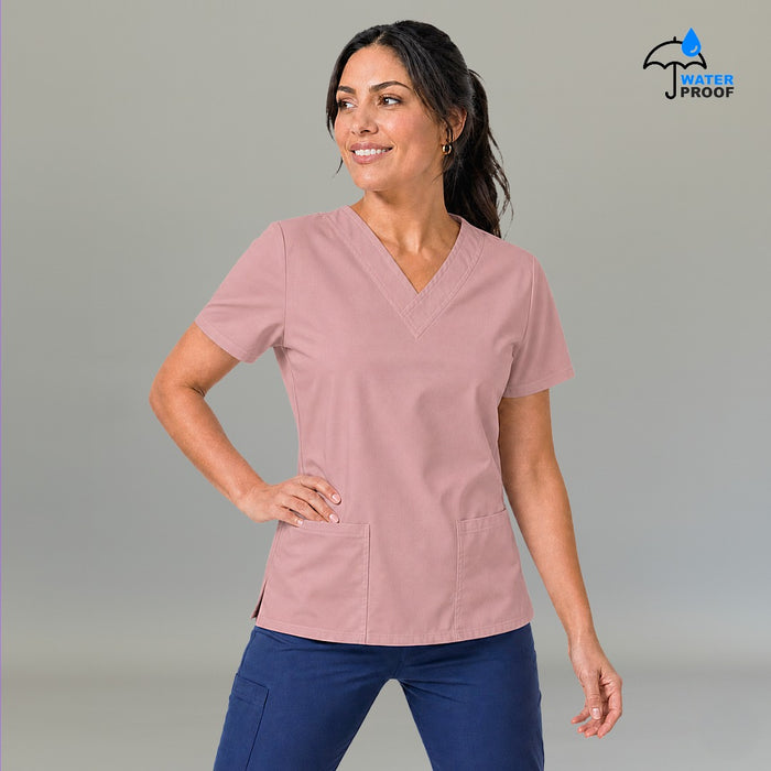 Women's dusty pink lightweight scrub top 502 V-neck with hand on hip — fluid-resistant medical uniform for nurses by S-FOR-ME