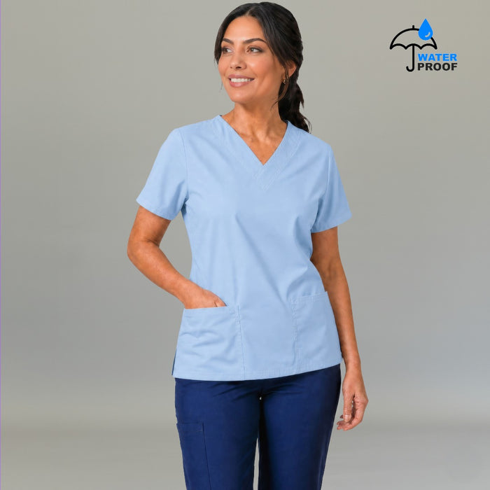 Women's sky blue 502 scrub top with hand in front pocket — lightweight fluid-resistant nursing top S-FOR-ME
