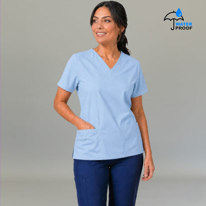 Women's sky blue 502 scrub top with hand in front pocket — lightweight fluid-resistant nursing top S-FOR-ME