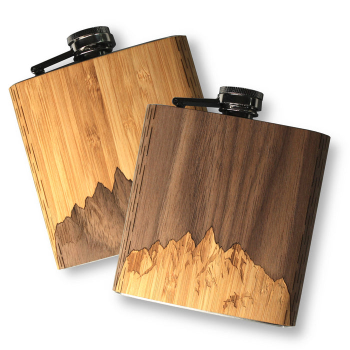 Black walnut wooden hip flask from WUDN Handcrafted, showcasing smooth finish and handcrafted details on a dark wood surface.