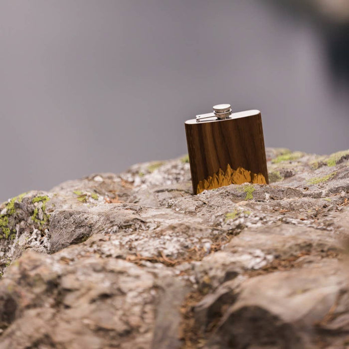 Handcrafted black walnut wooden hip flask from WUDN, featuring smooth finish and compact design for portable storage.