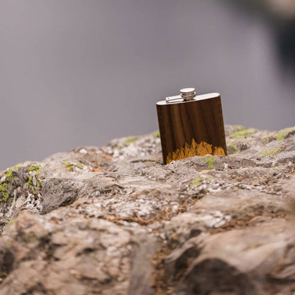 Handcrafted black walnut wooden hip flask from WUDN, featuring smooth finish and compact design for portable storage.