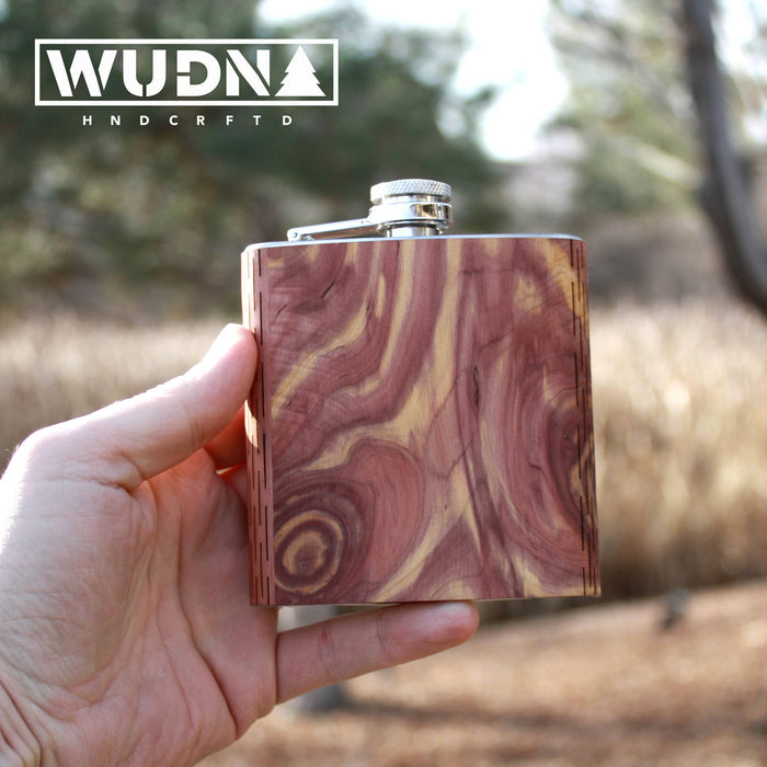 Handcrafted black walnut wooden hip flask from WUDN, showcasing smooth finish and sleek design.