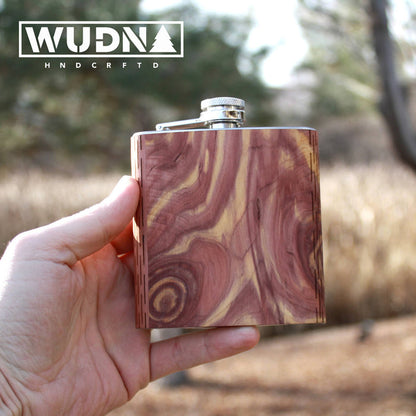 Handcrafted black walnut wooden hip flask from WUDN, showcasing smooth finish and sleek design.