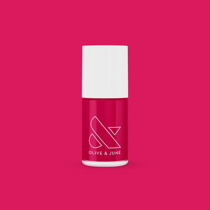 XOXO nail polish bottle in bright hot pink shade on matching pink background for vibrant manicure looks