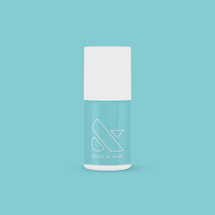 Bottle of Yes Please nail polish in a turquoise shade by Olive and June for vibrant, long-lasting manicures