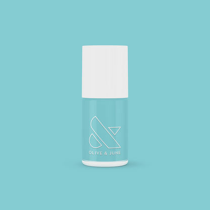 Bottle of Yes Please nail polish in a turquoise shade by Olive and June for vibrant, long-lasting manicures