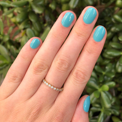 Hand with nails painted in smooth turquoise shade Yes Please for a vibrant, long-lasting manicure by Olive and June
